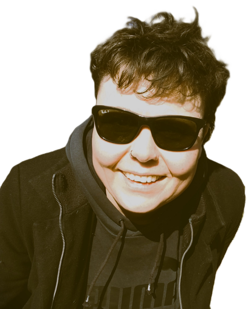 Home Sicco/Francisco on a sunny winter day wearing sunglasses and smiling cheerfully