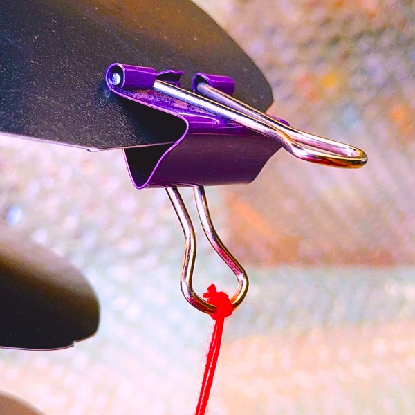 Home time plate; circle with a hole in the middle. A paper clip indicates an ancestor.