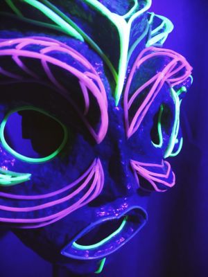 Home mask with fluorescent details in UV light